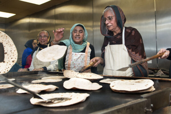 The Guru Gobind Singh Gurdwara on Gobind Marg in central Bradford. Alongside the prayer hall is the langar, or community kitchen, which serves vegetarian meals to all free of charge. The kitchen, a central feature of all Gurdwaras, is run by Sikh community volunteers who are doing seva, or 