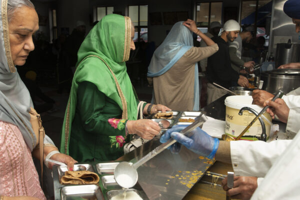 The Guru Gobind Singh Gurdwara on Gobind Marg in central Bradford. Alongside the prayer hall is the langar, or community kitchen, which serves vegetarian meals to all free of charge. The kitchen, a central feature of all Gurdwaras, is run by Sikh community volunteers who are doing seva, or 