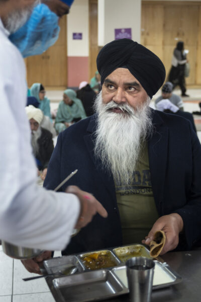 The Guru Gobind Singh Gurdwara on Gobind Marg in central Bradford. Alongside the prayer hall is the langar, or community kitchen, which serves vegetarian meals to all free of charge. The kitchen, a central feature of all Gurdwaras, is run by Sikh community volunteers who are doing seva, or 