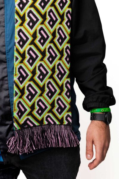 A Bradford 2025 scarf with gold, pink and green colours and the Bradford 2025 heart logo.