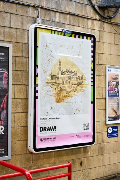 A poster on a wall station. There is a drawing on the poster of Centenary Square in Bradford.